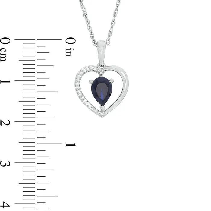Goldia Necklaces PearShaped LabCreated Blue Sapphire and 005 CT TW Diamond Heart Pendant in Sterling Silver Goldia Necklaces PearShaped LabCreated Blue Sapphire and 005 CT TW Diamond Heart Pendant in Sterling Silver